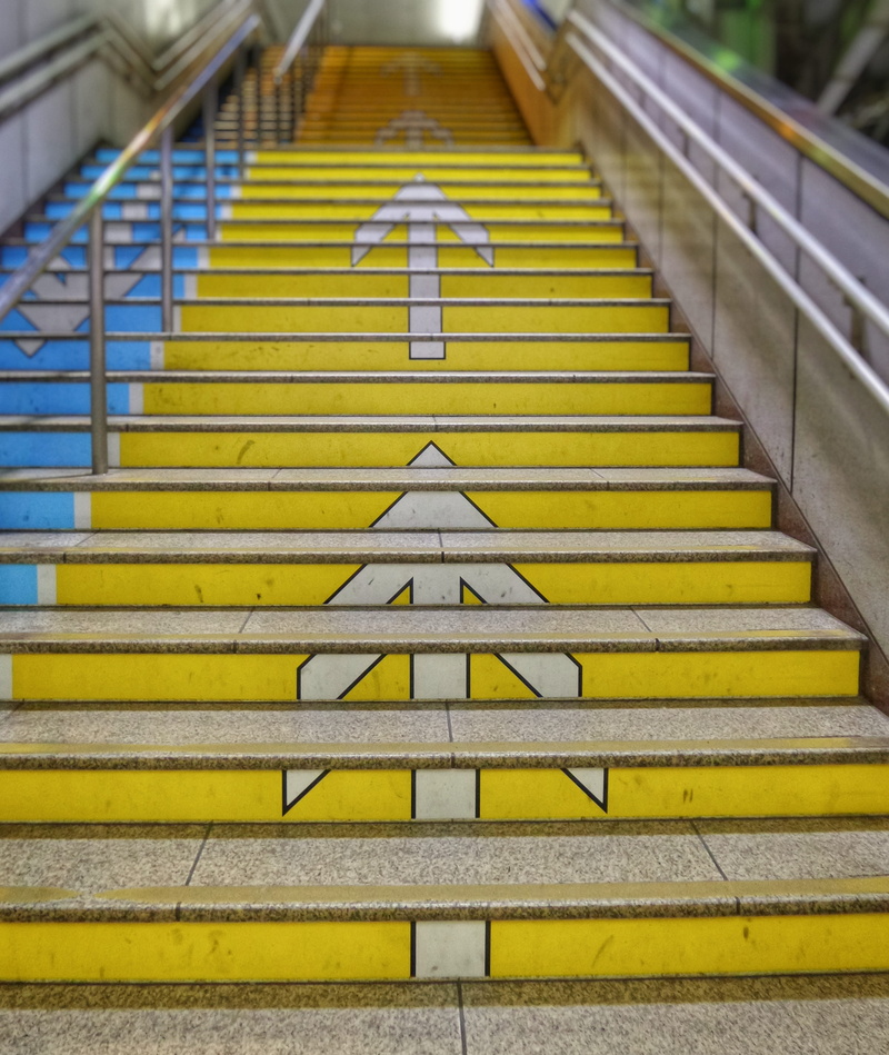 day, tokyo, architecture, japan, station, yellow, symbol, climb, top, focus on foreground, stairs, railing, no people, transportation, sign, upstairs, icon