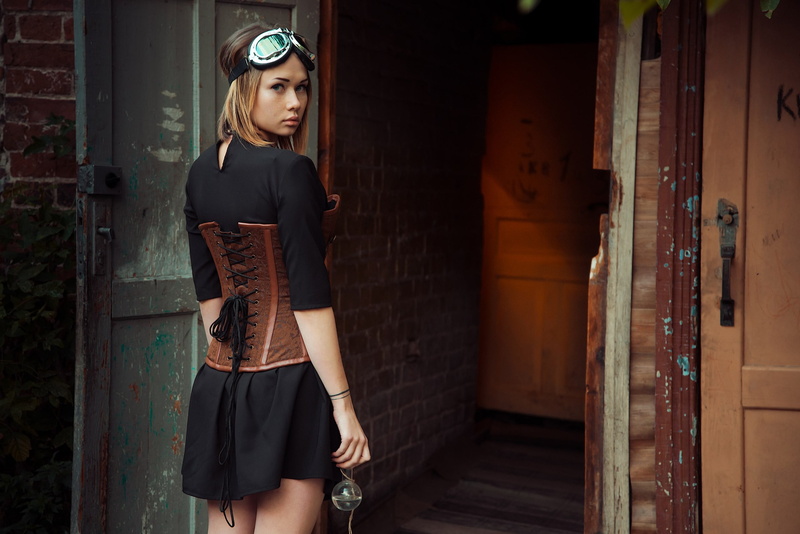 architecture, clothing, 2K, hairstyle, built structure, lifestyles, outdoors, standing, test-tube, young women, steampunk, corset, real people, leisure activity