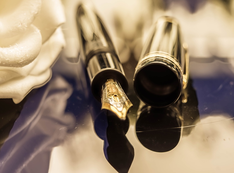 valuable, gun, filler, wealth, ink, metal, shiny, food and drink, crime, close-up, studio shot, expensive, indoors, montblanc, no people, selective focus