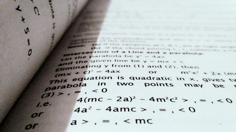western script, text, no people, mathematics, school, book, shadow, close up, number, close-up, indoors, publication, blur, black and white, page, knowledge