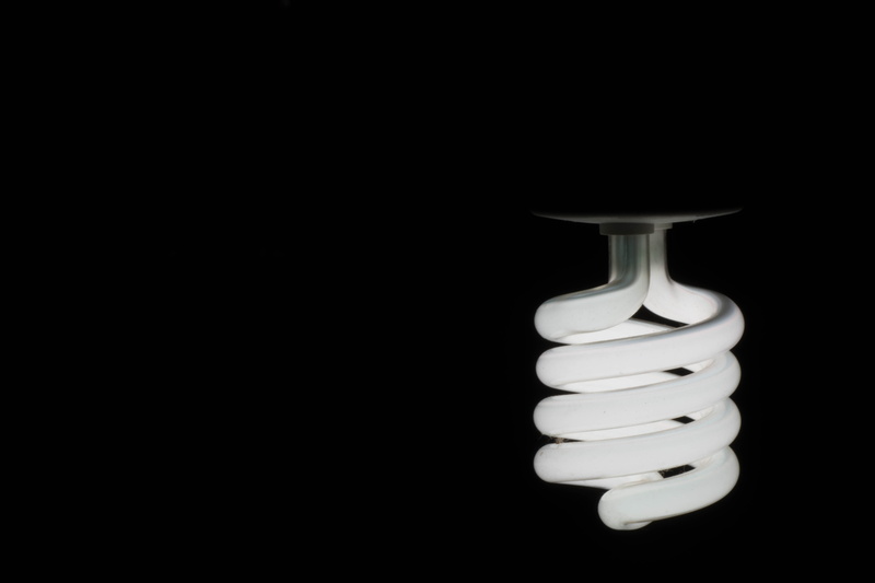 spiral, bulb, indoors, bright, black background, close-up, glowing, dark light, energy, electric lamp, single object, environment, no people, lamp, simplicity