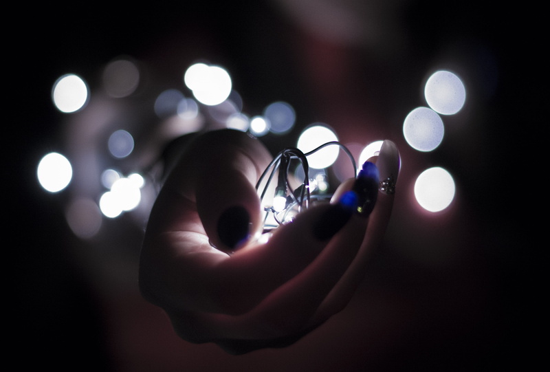 close-up, human hand, technology, illumination, spotlight, bulb, finger, light - natural phenomenon, idea, body part, dark, glowing, light, no people, focus on foreground