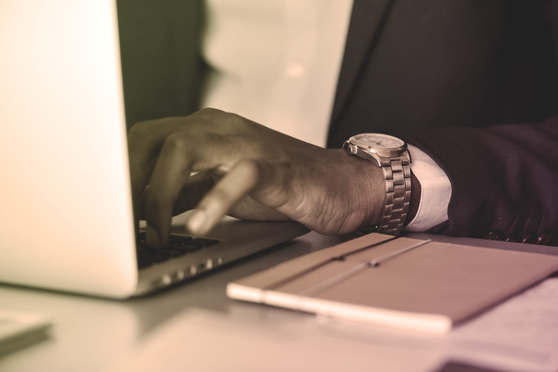digital device, human limb, business person, person, communication, using laptop, desk, closeup, hand, note, connection, watch, laptop, african, close-up