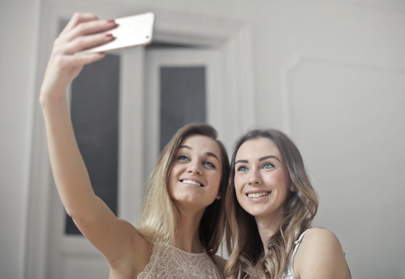 open hair, Girl, girlfriends, wireless technology, two women, Smiling, togetherness, Camera, friend, photographing, young women, self portrait photography