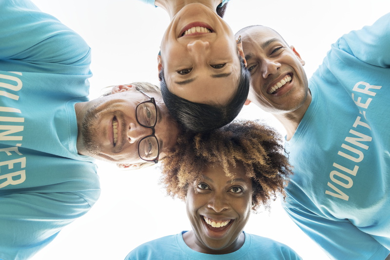 adult, diverse, teenager, headshot, cooperation, smiling, togetherness, friends, black, man, huddling, young men, looking at camera, blue, european, happiness