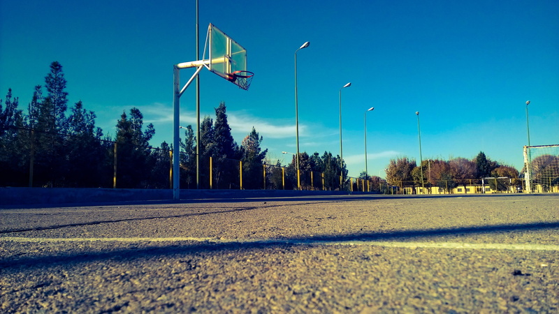 shadow, landscape, no people, road, sport, city, street light, street, clear sky, sky, built structure, blacktop, transportation, surface level, day, environment