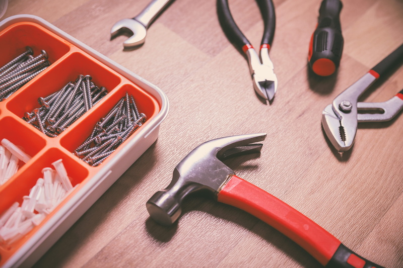 toolbox, no people, wrench, spanner, group of objects, table, equipment, pliers, hammer, work tool, set, metal, hand tool, indoors, close-up, high angle view