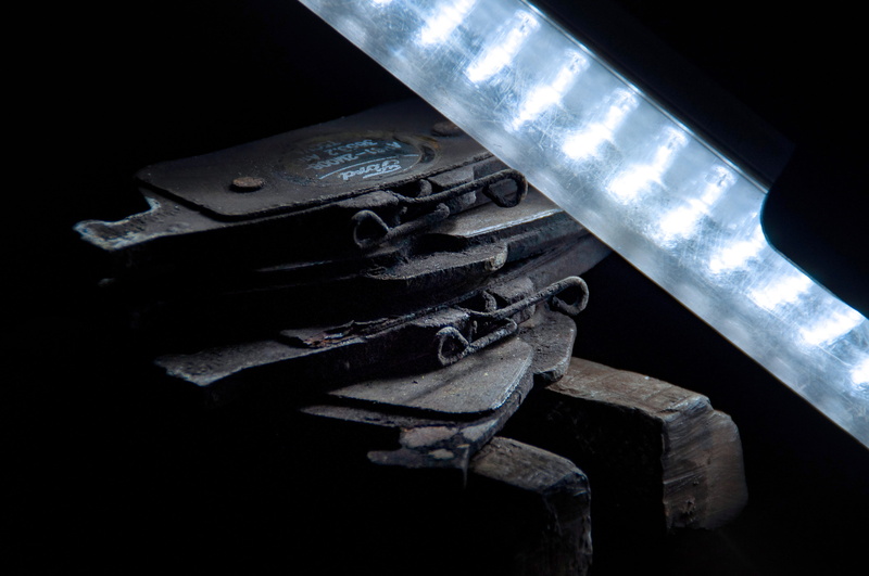 obsolete, black background, braking clogs, close-up, high angle view, inspection, dark, metal, auto, dirty, wheel, alloy, large group of objects, industry