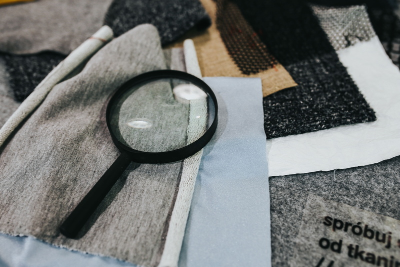 cloth, enlarge, material, glass, human body part, table, hand glass, focus on foreground, currency, one person, fabric, transparent, high angle view, circle