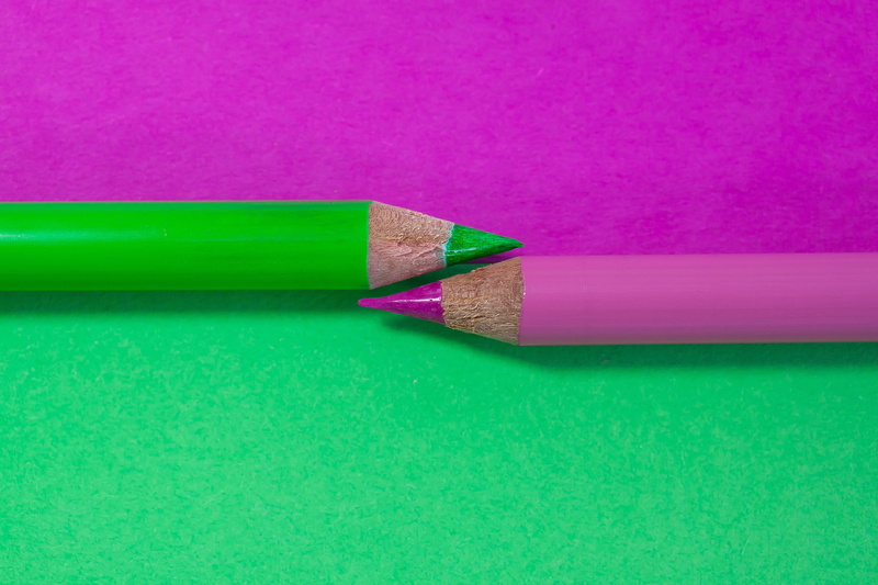 studio shot, pink color, art and craft, education, tips on, green, no people, colored pencil, creativity, writing instrument, wood, still life, indoors