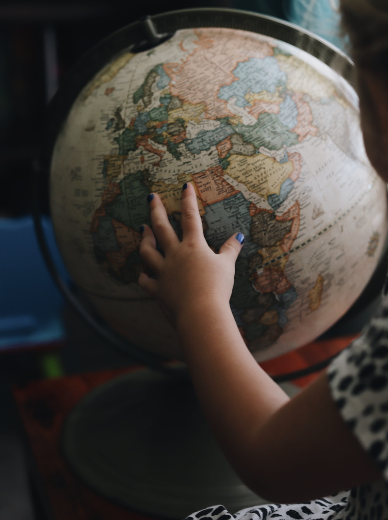 globe - man made object, planet earth, world, globe, atlas, childhood, hand, focus on foreground, child, one person, explore, earth, kid, human hand, country