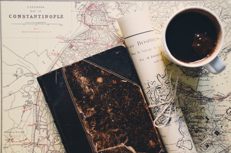 indoors, coffee - drink, near, no people, wealth, financial, coffee cup, plan, desk, destination, still life, beverage, food, text, travel, food and drink