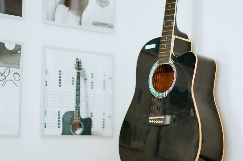 string, banjo, guitar, window, viola, mandolin, focus on foreground, violin, brown, no people, text, musician, leisure activities, paper, musical equipment