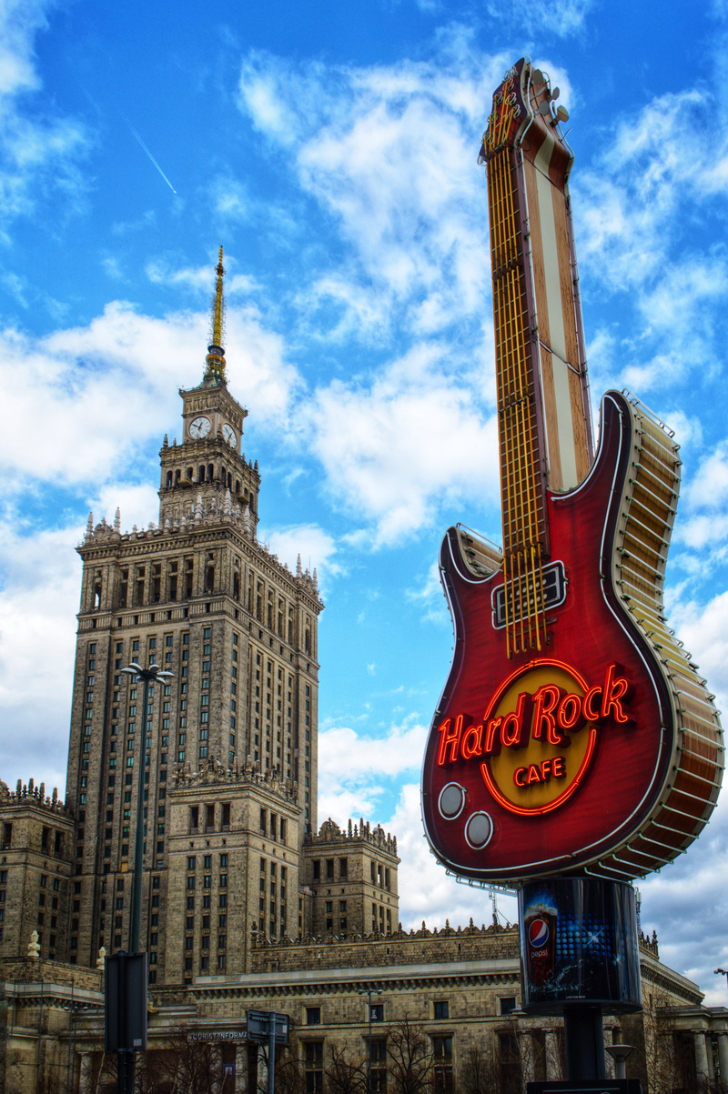 sign, nature, electric guitar, urban, communication, metropolis, skyscraper, rock, steeple, spire, building, high rise, road sign, text, building exterior