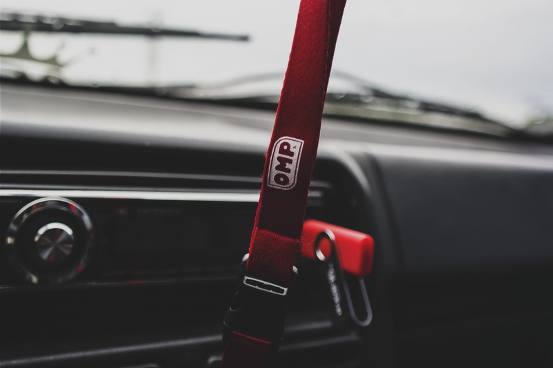 car interior, close-up, red, wheel, no people, dashboard, indoors, radio, transportation, land vehicle, communication, retro styled, macro, car, automotive