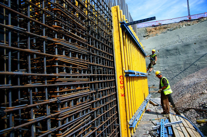 one person, wall, 5K, man, worker, horizontal, background, metal, hat, reflective clothing, outdoor, design, concrete, standing, protective workwear, working