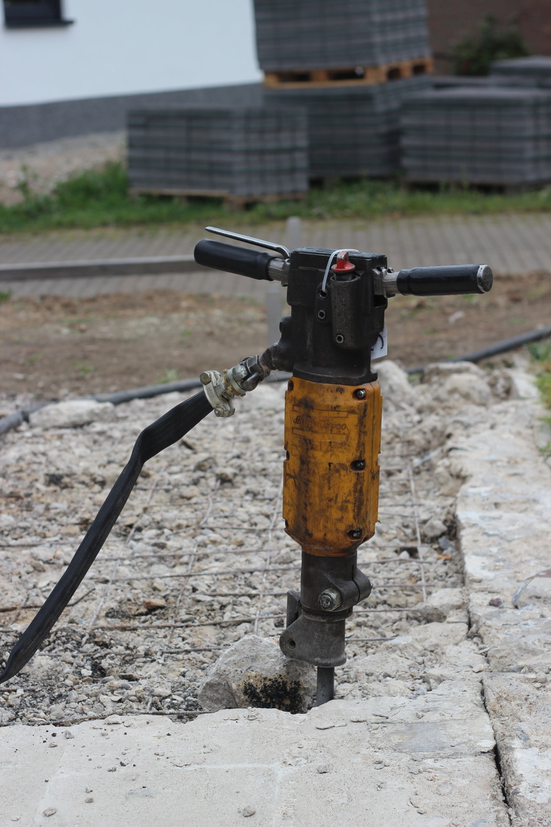 building rubble, hilti, construction workers, powerful, destroy, 5K, smash, chisel, no people, focus on foreground, footpath, security, water, renovate