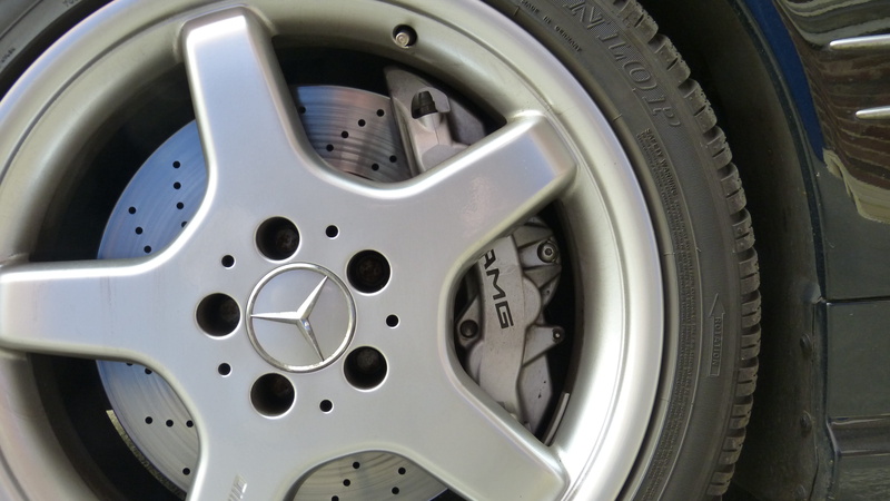 vehicle, silver colored, alloy, extreme close-up, equipment, clean, motor vehicle, water, motorcycle, mature, transportation, chrome, brake disc, macro