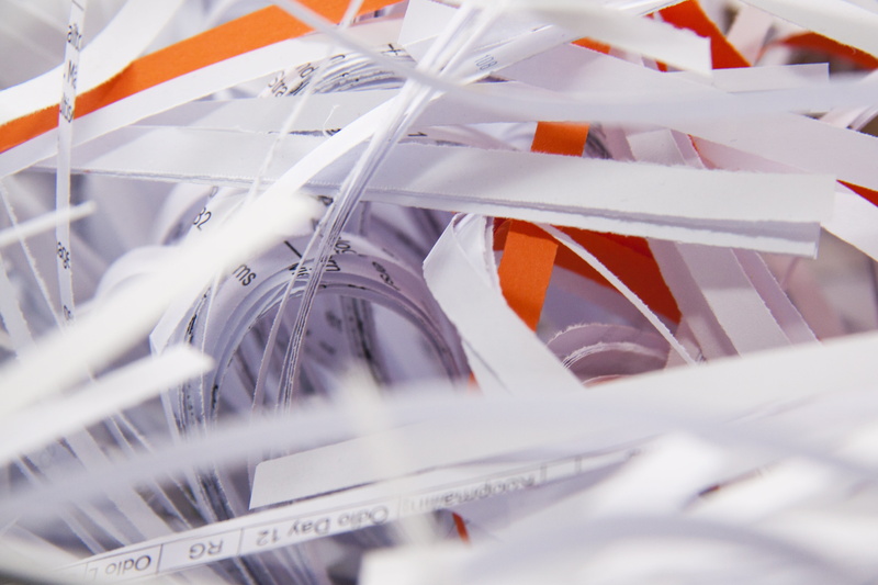 focus on background, mechanically, grinder, shredder, recycling, shredded paper, paper strip, selective focus, orange color, close, no people, accuracy