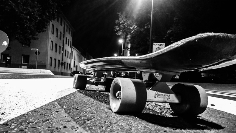 outdoors, mode of transportation, day, snow, wheel, skateboard, car, land vehicle, urban, monochrome, built structure, no people, building exterior, Penny