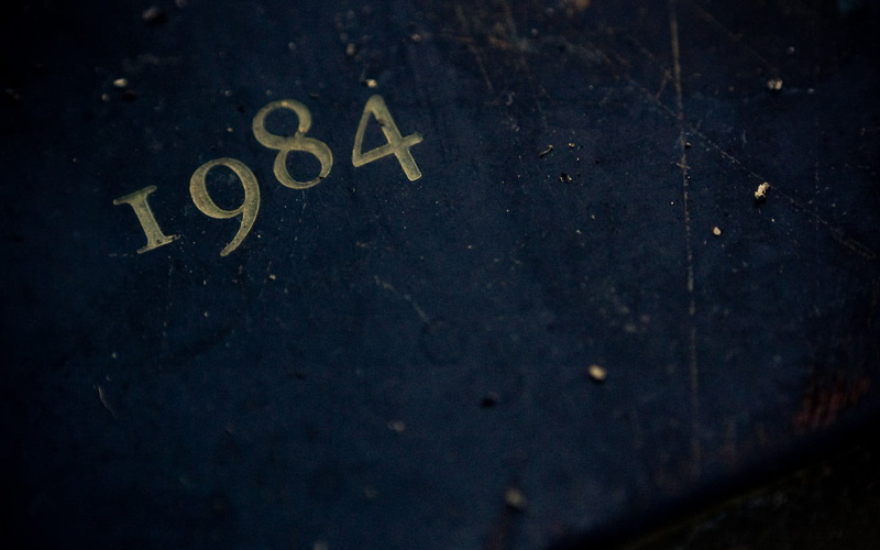 literature, numbers, western script, symbol, indoors, close-up, 720P, letter, night, 1984, yellow, no people, text, message, black color, road sign, untitled