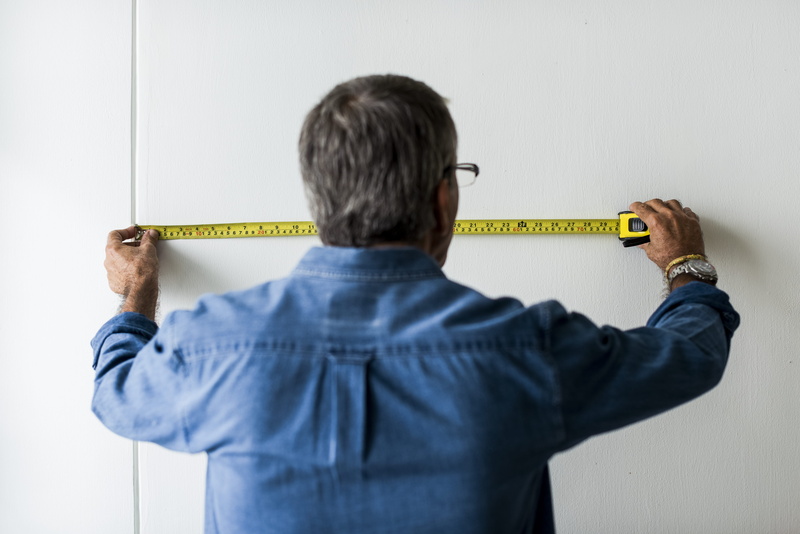 equipment, men, home improvement, measure, accuracy, wall - building feature, sleeved, business, collared, shirt, rear view, long, holding, hands, measuring