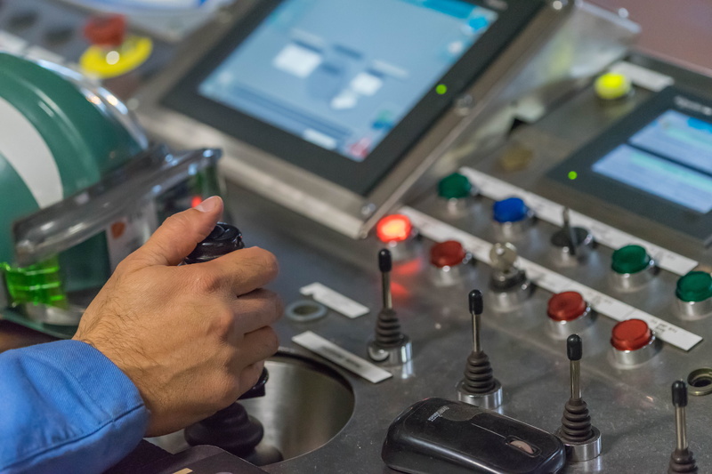 steel, button, factory, technology, human hand, focus on foreground, industry, human body part, holding, finger, complexity, joystick, technician, expertise