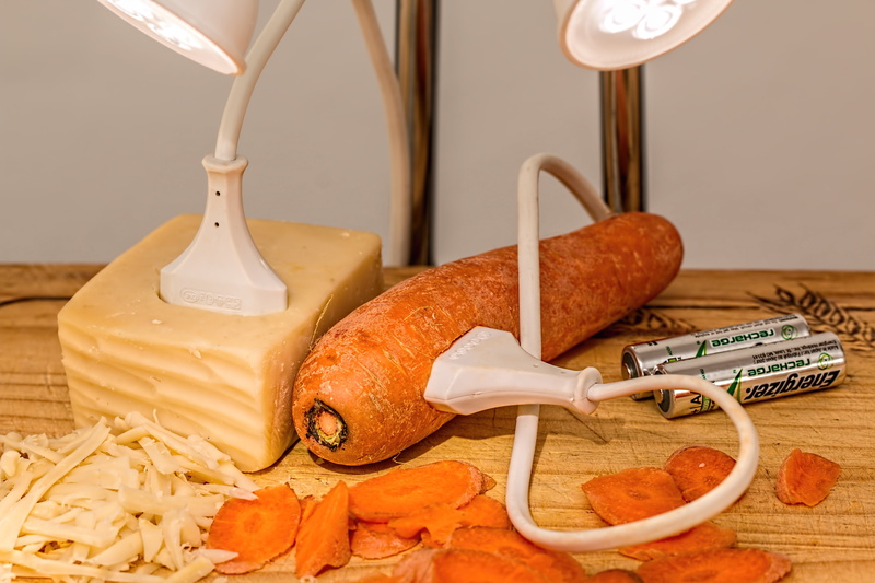 music, energizer, cutting board, wood - material, snack, no people, plug, technology, wire, white, nourishment, table, light, carbohydrates, sustainable energy
