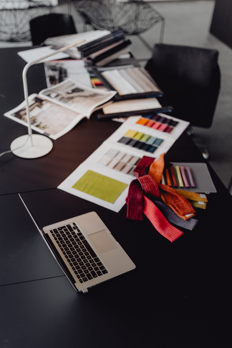 technology, designer, focus on foreground, indoors, office, paper, business, black furniture, table, black table, interior designer, interior, work, furniture