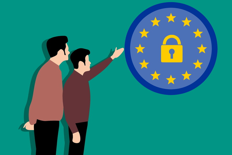 indoors, happiness, security, pointing, information, protection, men, blue, colored background, ecstatic, two people, two, young adult, regulation, togetherness
