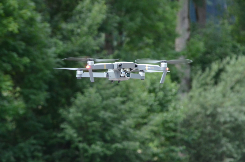 security, flying, aerial view, drone, air, mid-air, forest, nature, photography themes, no people, camera - photographic equipment, mode of transportation