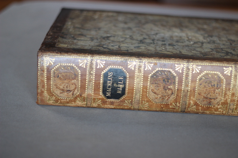 single object, design, close-up, paper, indoors, communication, high angle view, text, studio shot, finance, table, craft, bible, western script, time