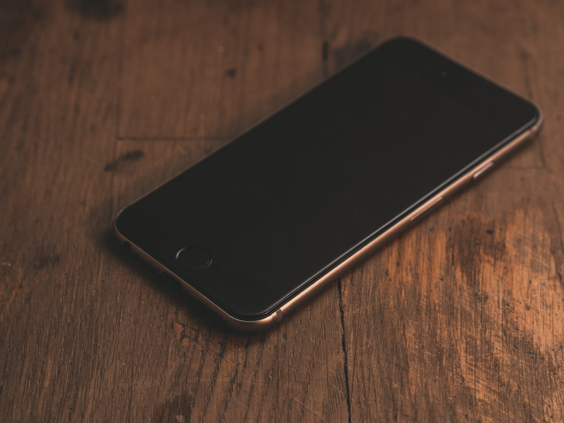 smart phone, black color, close-up, telephone, device, single object, high angle view, brown, no people, smartphone, wood - material, still life, portable information device