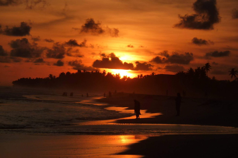 silhouette, beach, nature, sea, sunlight, tranquil scene, idyllic, tranquility, holiday, water, orange color, reflection, lanka, no people, siri lanka