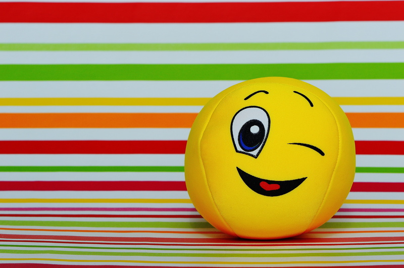 high angle view, human Face, Cute, smiling, no people, 5K, celebration, illustration, striped, anthropomorphic smiley face, toy, Wink, anthropomorphic face