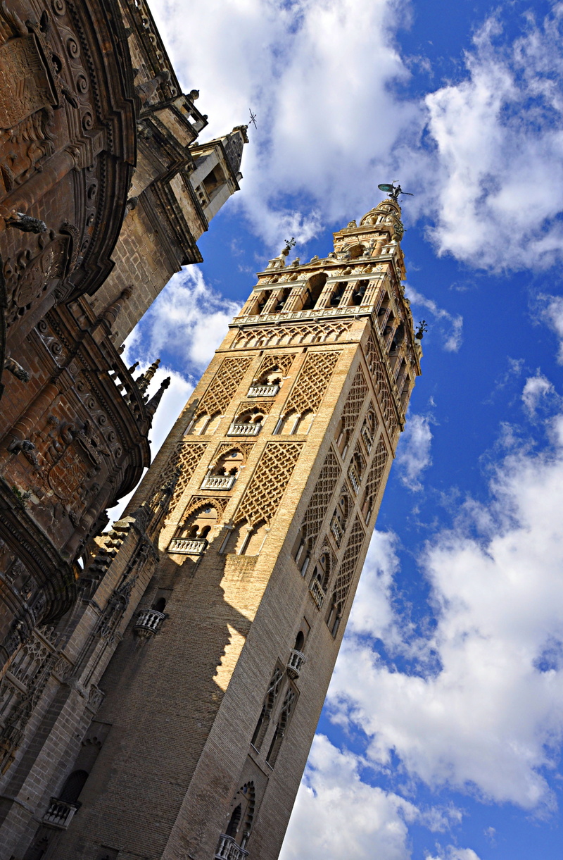 travel destinations, day, almohads, tourism, catholicism, building exterior, spain, directly below, nature, building, art, travel, seville, architecture