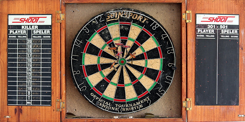 shape, accuracy, leisure activity, game of darts, center, dart board, geometric shape, day, pattern, skill, play, precision sports, wood - material, text