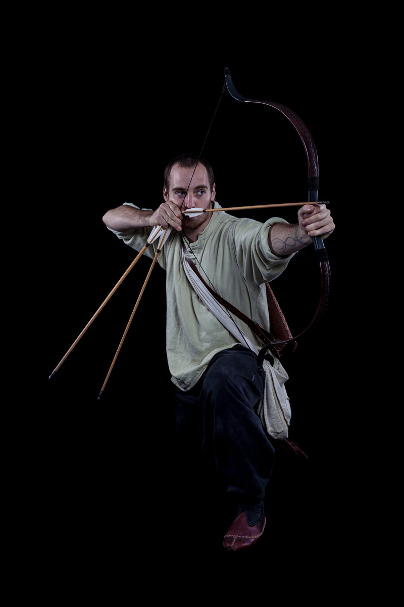 warrior, young, black background, target, person, indoors, holding, knight, lifestyles, antique, composite, history, arch, historically, men, costume, front view