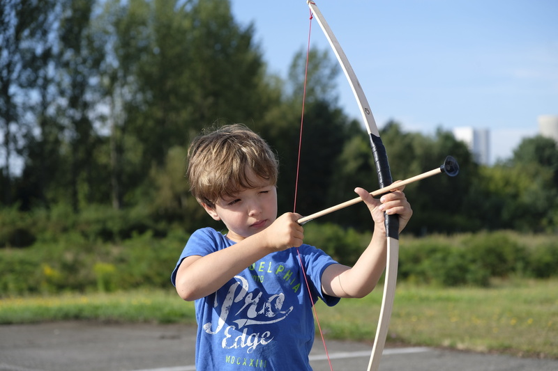 arrow - bow and arrow, archery, front view, men, arch, holding, sport, tree, leisure activity, arrow, child, play, plant, standing, innocence, males, boys