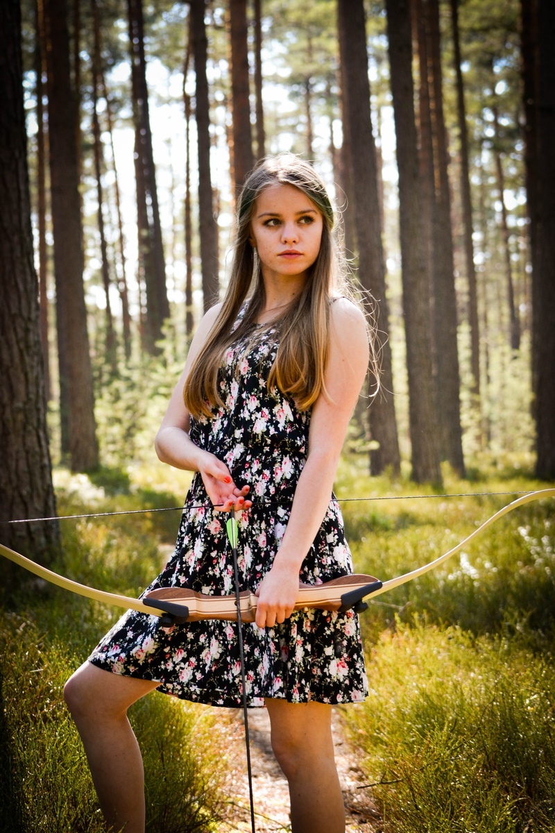 one person, lady, looking at camera, beauty, tree, arrow, hair, outdoors, real people, nature, plant, young adult, adults only, mini, forest, standing