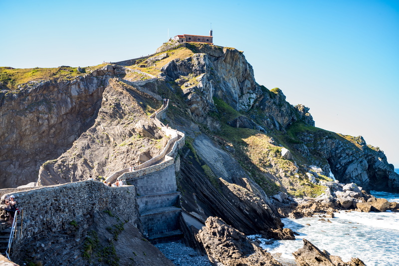 san juan de gaztelugatxe, beauty in nature, long, clear sky, nature, sunlight, solid, sky, ancient, rock formation, rock, rough, game of thrones, stairs
