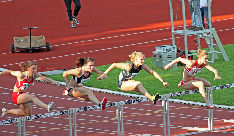 mid-air, clothing, young adult, jumping, group of people, hurdles, adult, athletics, athlete, women, running, sport, track and field athlete, four, human limb