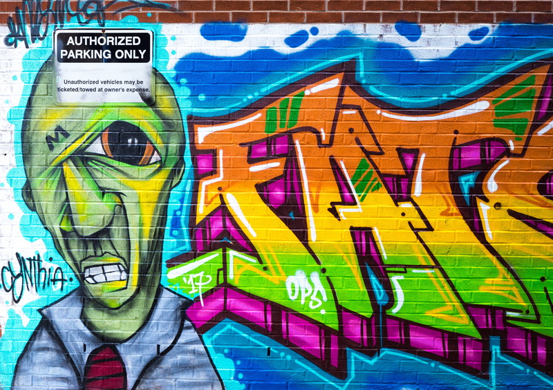 bricks, social issues, human representation, architecture, sign, multi colored, art and craft, art, day, brickwall, colourful, wall, brick, vandalism, outdoors