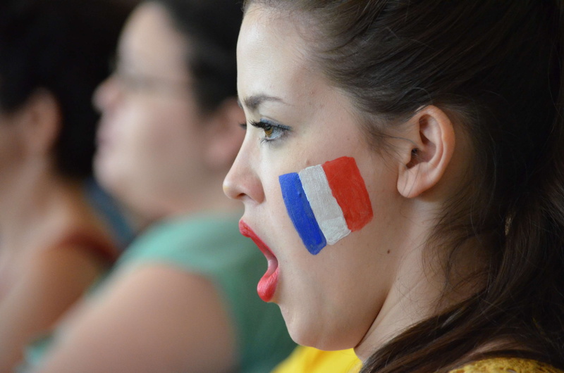 body part, french, close up, emotion, young women, looking, group of people, blur, close-up, hair, fan, human body part, eye lashes, patriotic, face paint