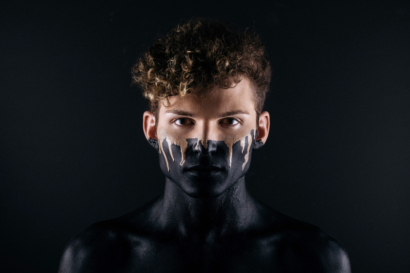 adhesive tape, silence, human face, paint, body part, male, close-up, human body part, one person, curly hair, censorship, black background, 2K, looking at camera