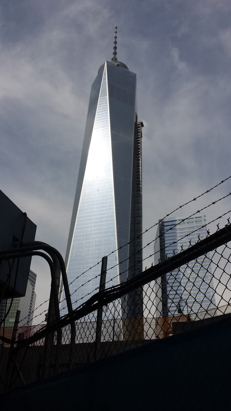 modern, safety, skyscraper, 1wtc, outdoors, security, built structure, tall - high, day, fence, new york city, sunlight, low angle view, ny, sky, no people