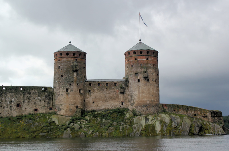 spire, steeple, sky, history, building, sea, outdoors, built structure, architecture, no people, moat, building exterior, medieval, olavinlinna castle