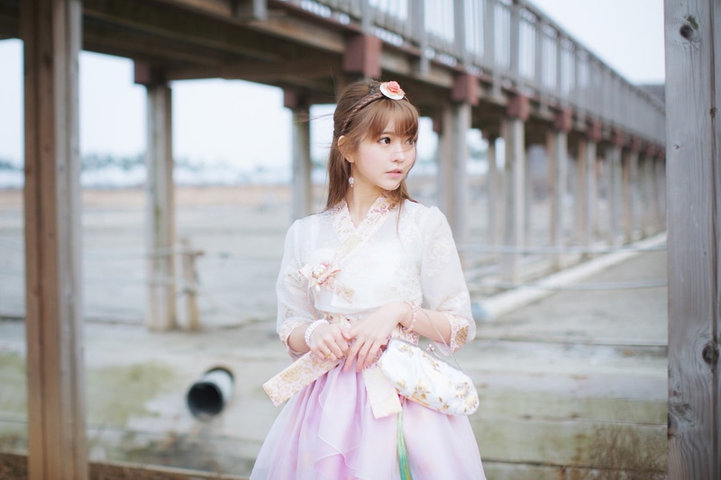 day, clothing, beautiful woman, architecture, focus on foreground, real people, traditional clothing, leisure activity, childhood, fashion, three quarter length