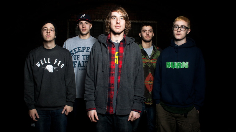 black, smiling, indoors, haircuts, men, hoodie, front view, young men, people, adult, teenager, foundation, nightlife, males, band, print, togetherness