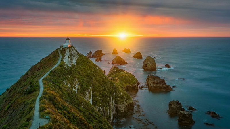 nature, lighthouse, rock, new zealand., outdoors, sunrise, sea, tranquil scene, solid, headland, promontory, land, nugget point, scenics - nature, horizon over water